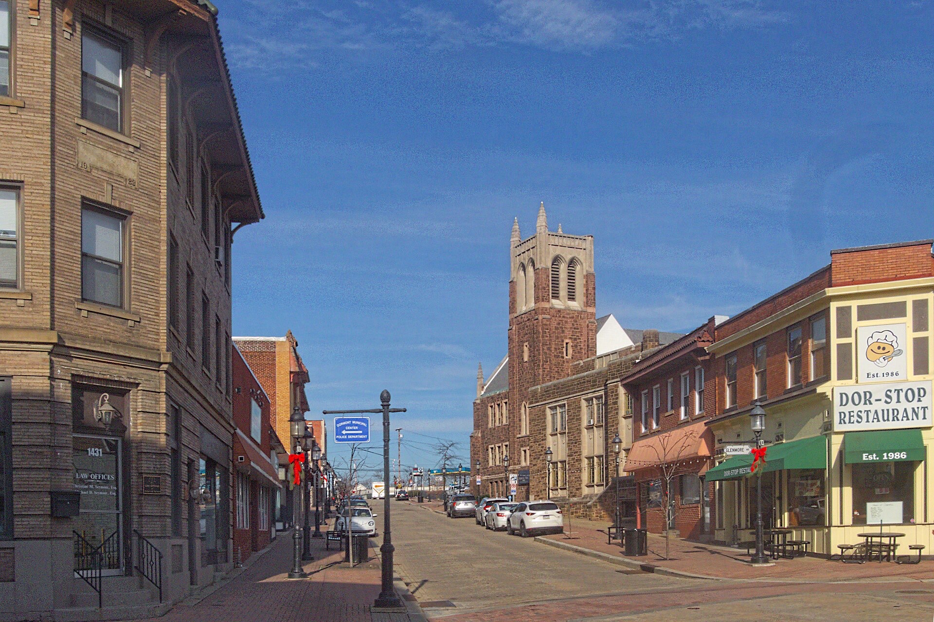 Potomac Avenue in Dormont looking toward the brick church tower and neighborhood shops